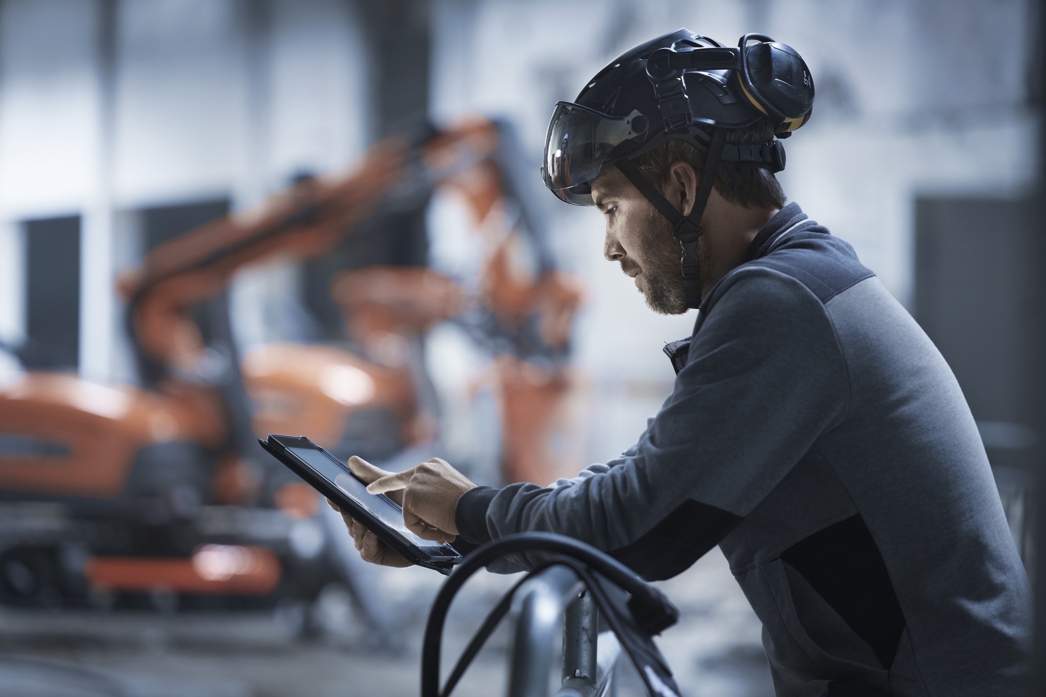 Husqvarna professional using a tablet to access Experience Center.